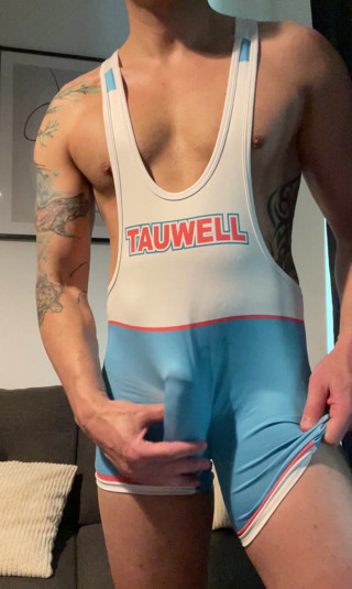 Smooth jock in wrestling singlet jerks off and cums