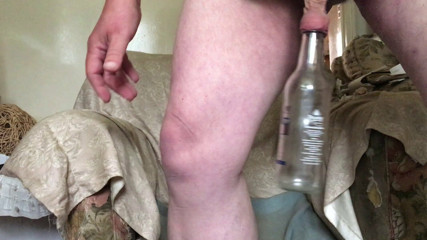 Back of a chair: foreskin with glass bottle