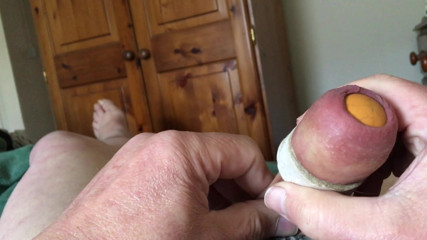 Stretch foreskin session - rubber egg