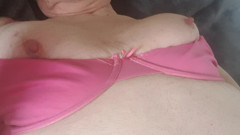 Undressing on a bed..bra and knickers