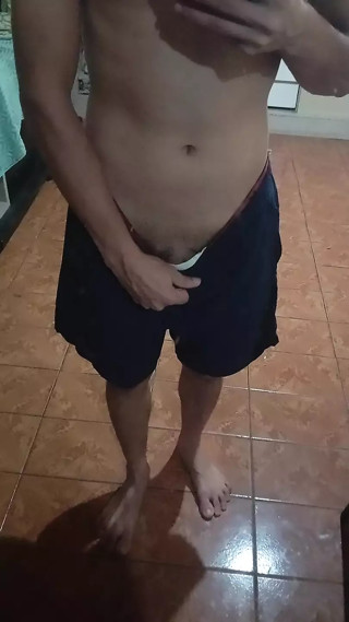 boy in shorts in the mirror