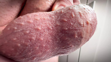 Close-up penis and egg massaging