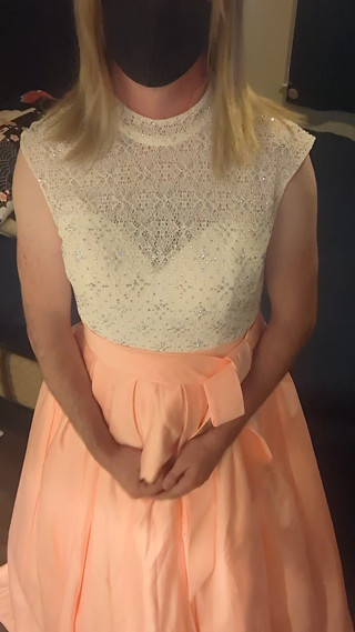 Enjoying a cuteute pink satin prom dress in bed