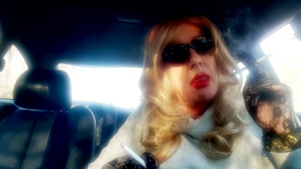 MrsRuthieRoman - a marture TG blonde smoking 2 VS120 menthols in her car thumbnail
