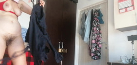 Sexy Latina Having Fun Trying on Clothes and Cutting Them