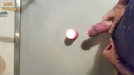 Homemade handjob and big load on a candle. Jerking off in a homemade amateur video, big cock and big load.
