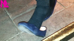 Dangling in Blue Ballet Flats in a Bar