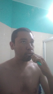Man washes his face