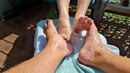 Massage oil on our feet for us while we relax