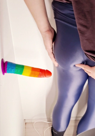 Crossdresser enjoying big toy in shiny leggings