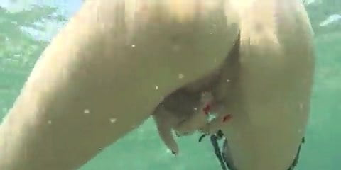 Nice girl is swimming in the sea.....