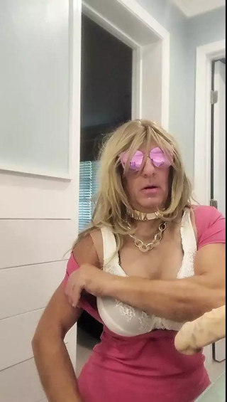 DeeDeeSlut69 in Pink Dress Sucking on a Thick Dildo thumbnail