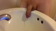 Peeing Draped Over a Sink