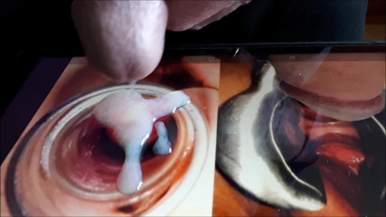 Cumshot a the photo of a wide open pussy by a speculum