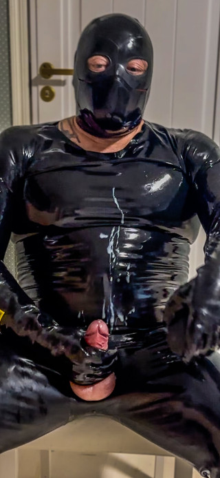 Rubber Man in Latex Catsuit and Penis Pump thumbnail