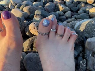 Hot and sexy feet of Mistress Lara in the sunset on public beach