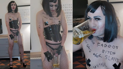 Sissy Whore in PVC and High Heels Drinks Her Own Piss thumbnail