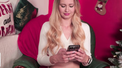 A beauty moans near the Christmas tree
