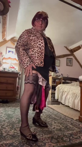 dressed in a shiny little black dress for an evening out thumbnail