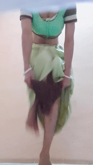 Crossdresser in blouse and peticoat with panty