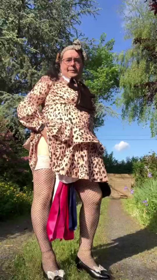 In an outfit with a little leopard-style dress for an evening out. thumbnail