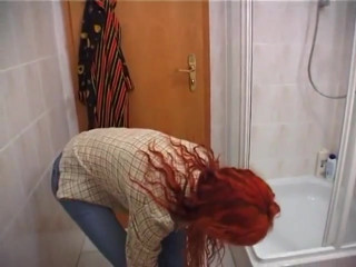 Redhead beauty showering solo