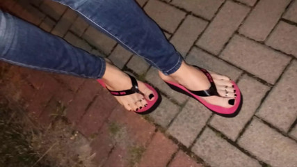 crossdresser in very sexy flip flops walks the street thumbnail
