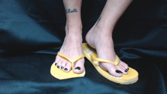 Yellow flipflops closeup shoeplay