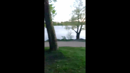 A naked guy walks in the park in public