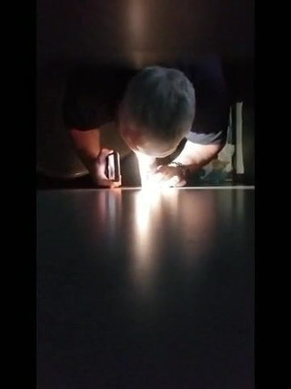 Him slipping off a condom on my cock, thru the gloryhole
