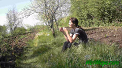 Pissing in grass on the side of the road