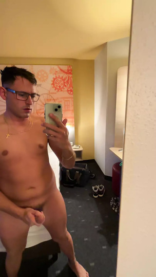 Sweet German boy jerks off early in the morning in the hotel room and squirts on the bed