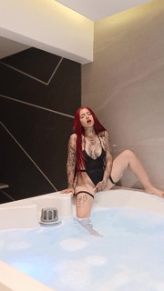 Redhead in jakuzzi alone