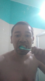 Man washes his face