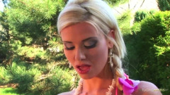 Solo cutie takes off her bikini while posing in the backyard