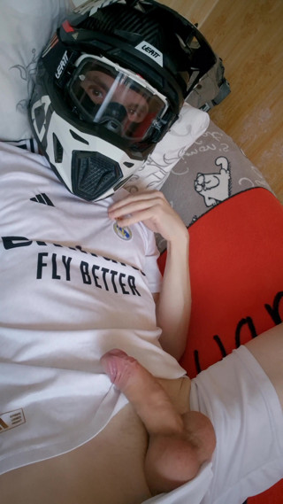 The Guy Is Wearing a Soccer Uniform and Mxhelmet with a Morning Cum