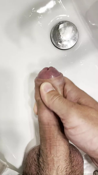 Masturbating with cumshot in a sink
