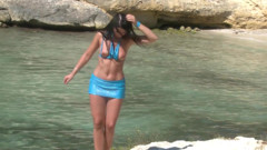 Brunette chick in outdoor action on the beach