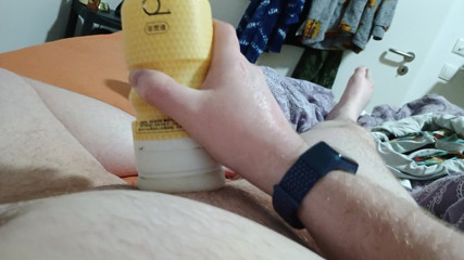Jerking off in bed in the evening with two toys