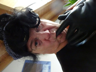 latex masked perv bessy enjoys sitting on giant dildoplug thumbnail