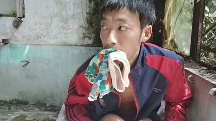 Super Asian boy lies in abandoned factory area, lying in sink, masturbating, ejaculating, moaning, and swallowing liquid