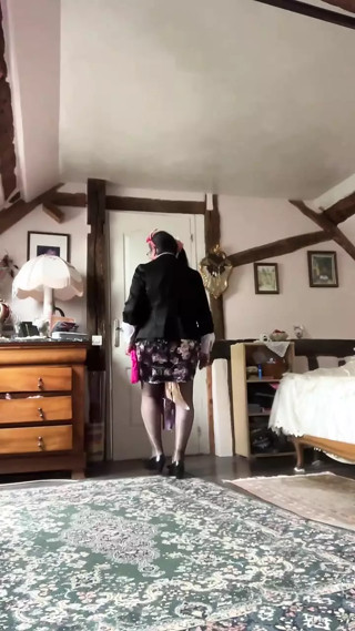 In a little floral skirt and fuchsia tie with stains for an evening