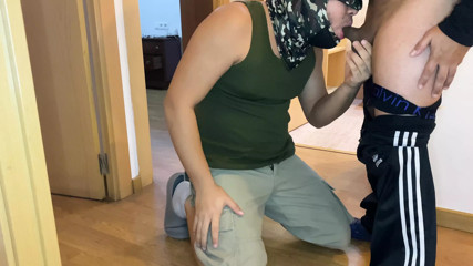 Young man sucks a mature man's fat cock in the hallway