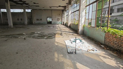 Cute Asian boy masturbates, moaning, ejaculating, and swallowing semen in a sunlit abandoned factory
