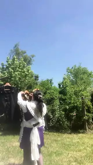 In planter with a purple dress hanging laundry thumbnail