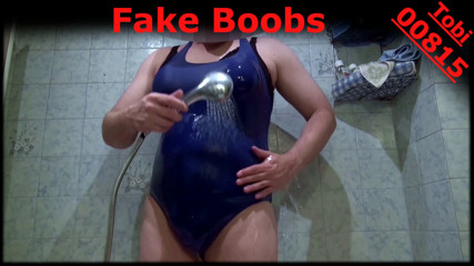 Fake Boobs - some posing in blue swimsuit, shaved body