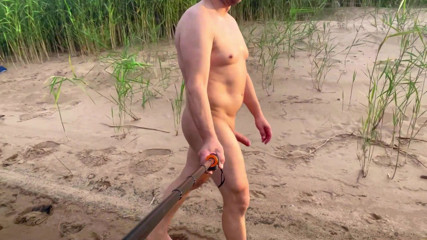 Spcer naked by the river, in public