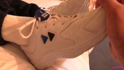Fondling her cheerleading shoes and socked feet Preview