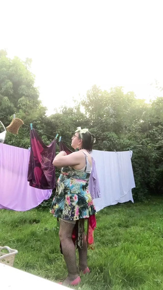 In outfit with a small short floral dress to pick up the laundry
