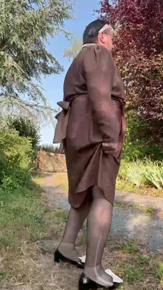 Wearing a brown Portefeuille-style dress for an evening